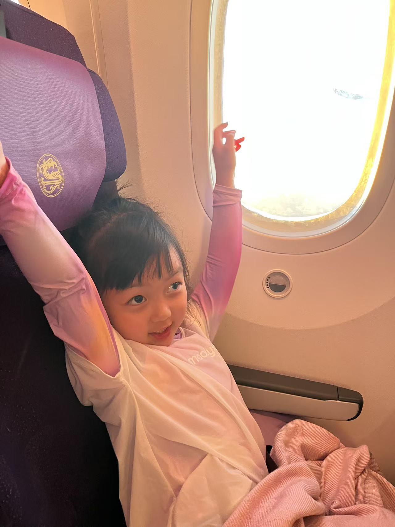 Mia stretching on plane
